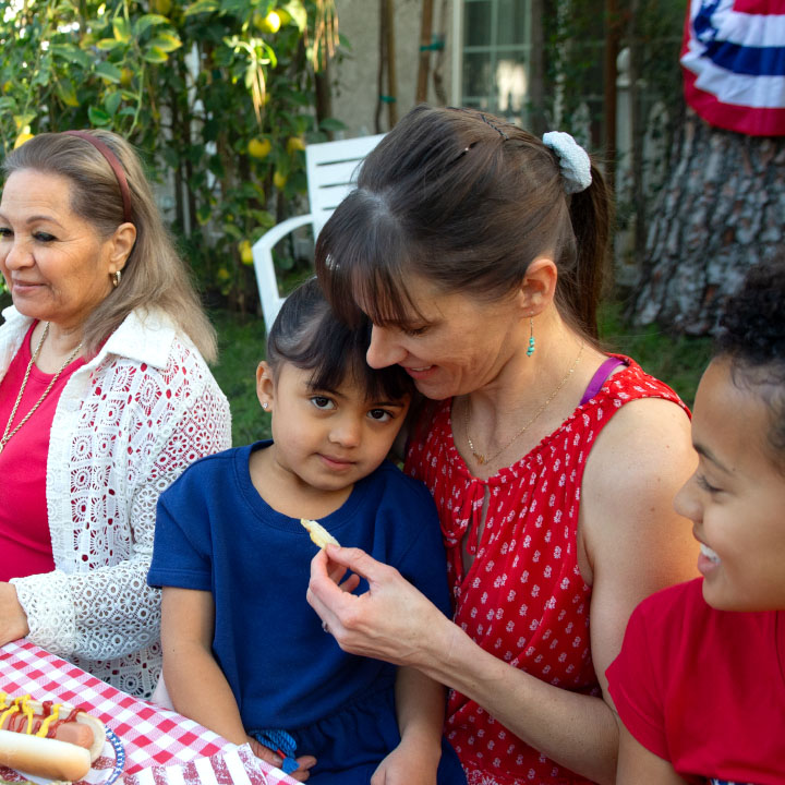 A mother and her young daughter enjoying lunch
